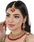 Elegant Kundan bridal choker set with intricate pearls, perfect for festive celebrations.
