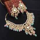 Stunning Kundan choker necklace with exquisite craftsmanship and embedded pearls for bridal look.
