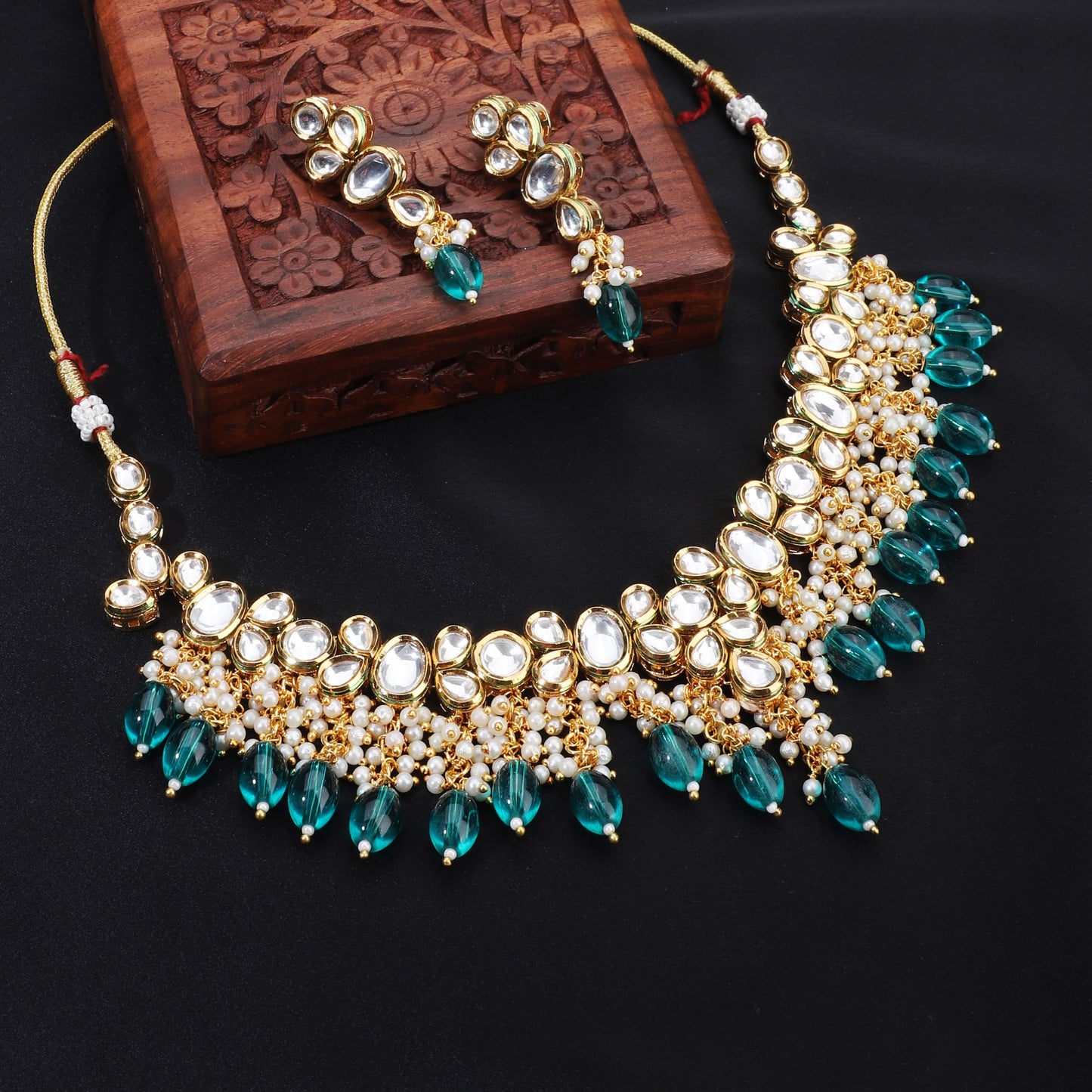 FESTIVE KUNDAN NECKLACE SET FEATURING STRIKING TEAL BIG PEARLS AND DELICATE WHITE SMALL PEARLS.