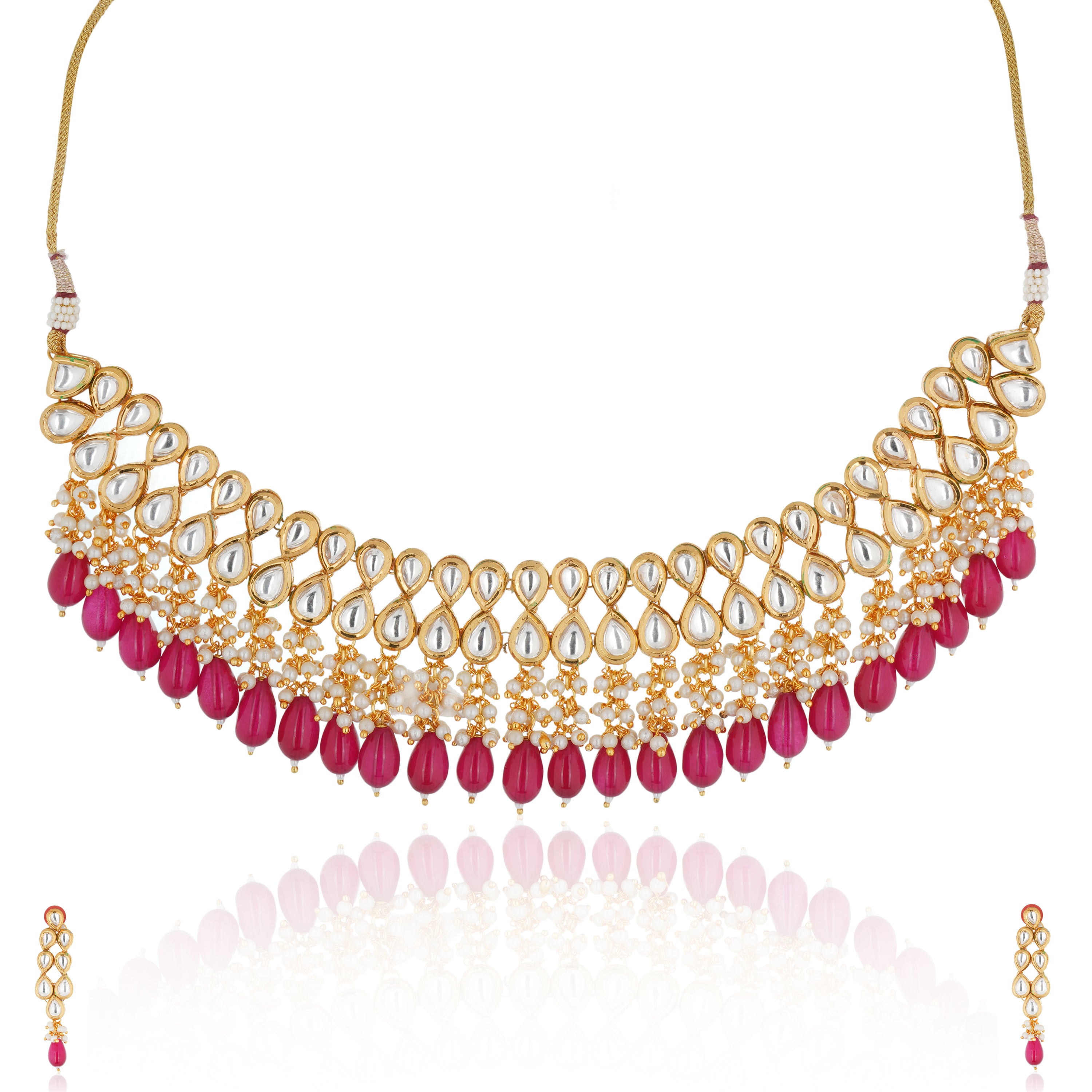 Kundan necklace set with red pearls, featuring two layers of intricate Kundan work and matching earrings.
