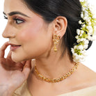 Elegant gold necklace set studded with sparkling Zircon stones for a brilliant festive look.
