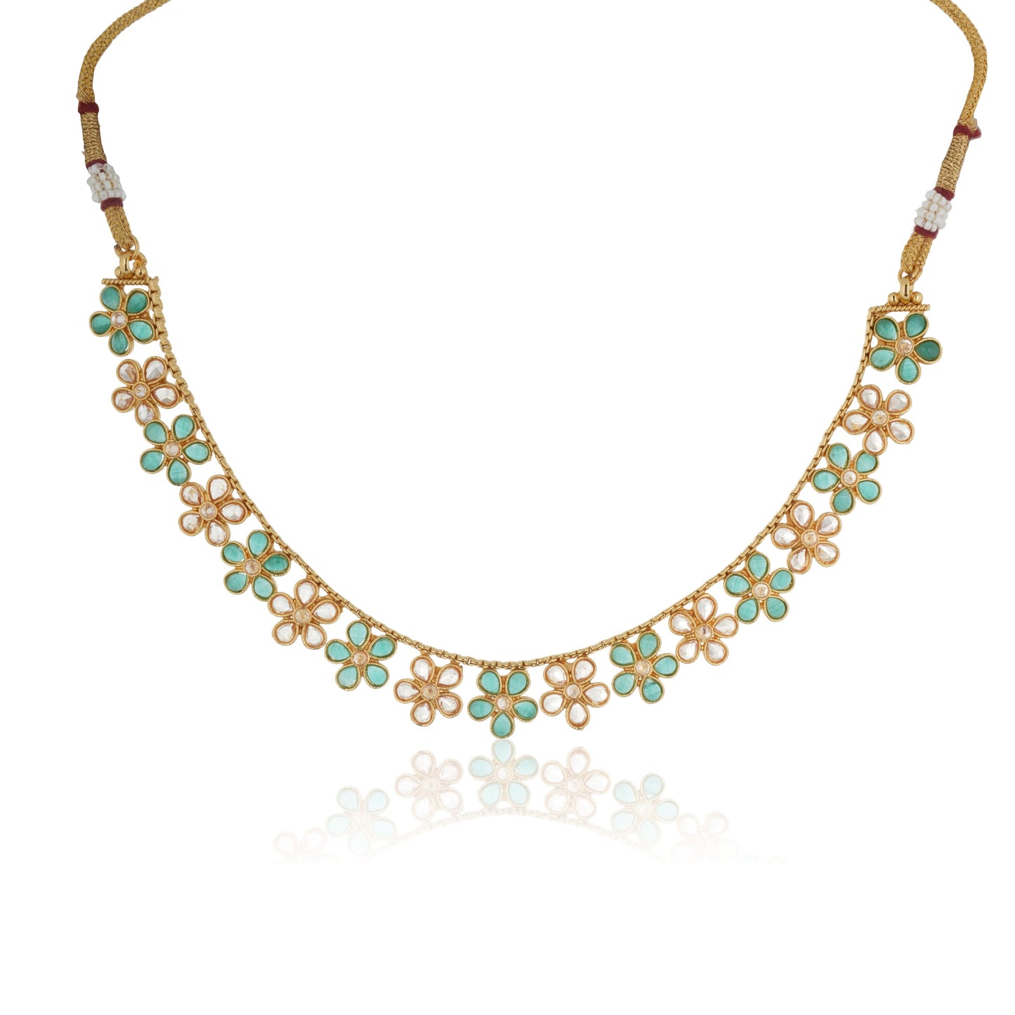 GREEN AND GOLDEN KUNDAN-STUDDED NECKLACE SET SHOWCASES A BEAUTIFUL  KUNDAN WORK.