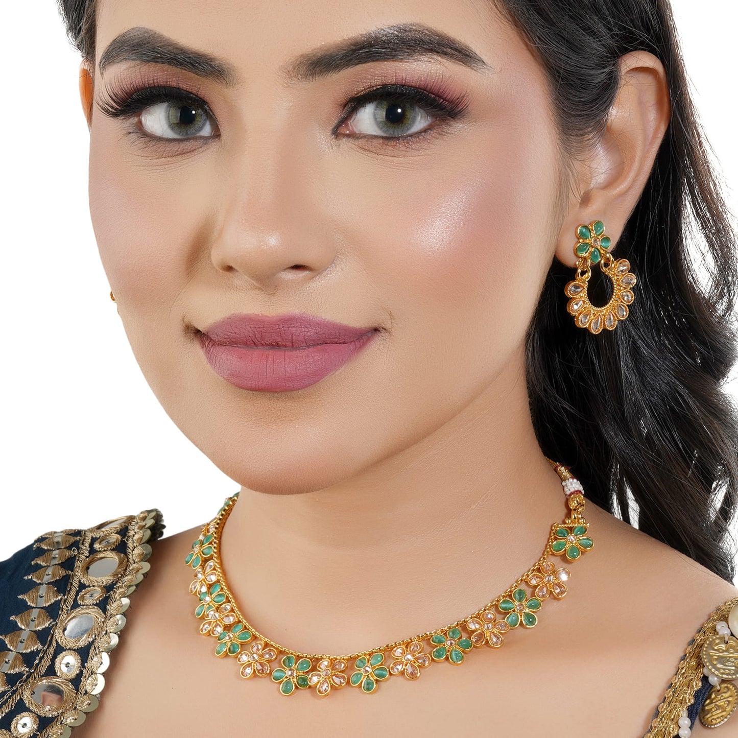 GREEN AND GOLDEN KUNDAN-STUDDED NECKLACE SET SHOWCASES A BEAUTIFUL  KUNDAN WORK.