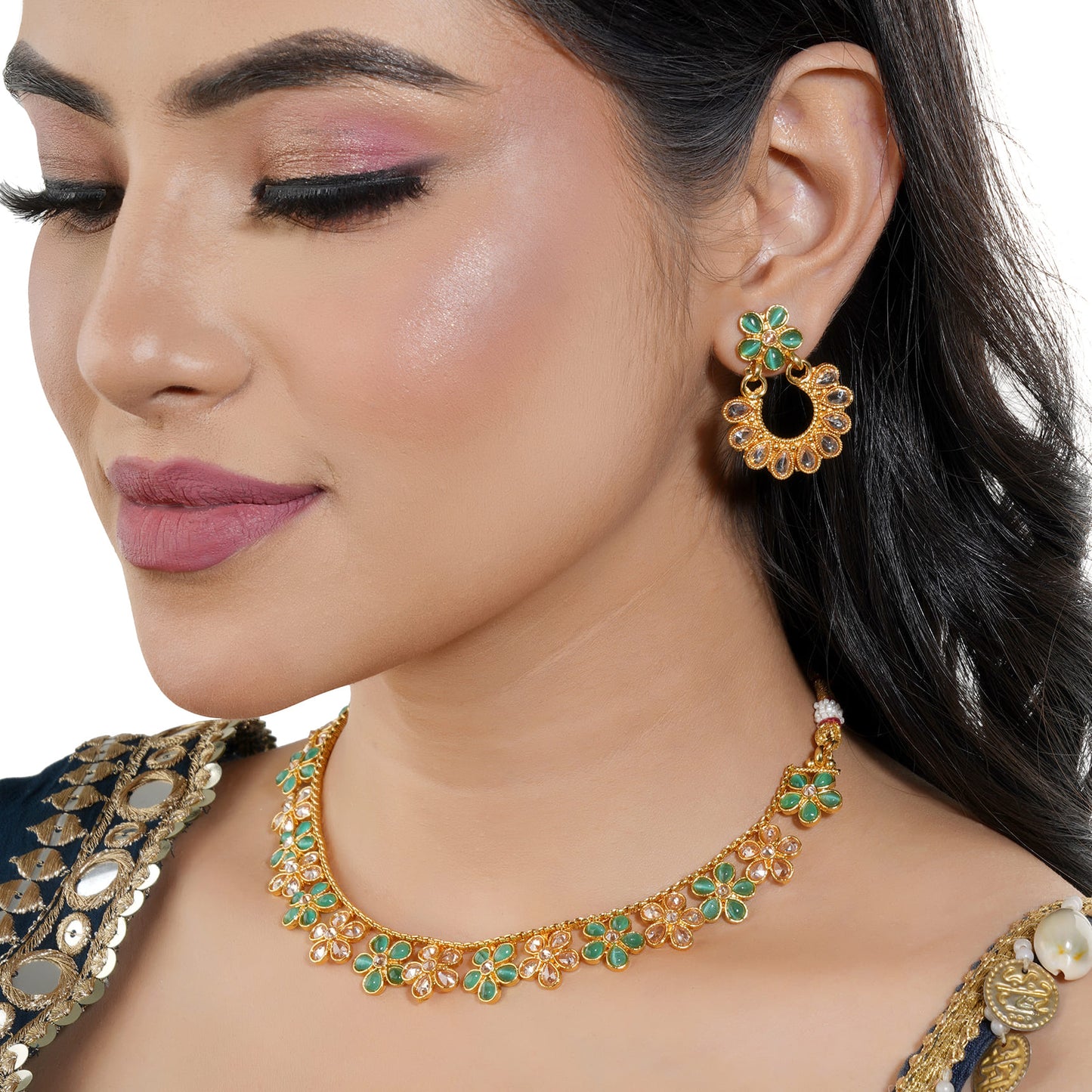 GREEN AND GOLDEN KUNDAN-STUDDED NECKLACE SET SHOWCASES A BEAUTIFUL  KUNDAN WORK.