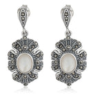 Elegant 925 silver pendant set with lustrous pearls and matching earrings for a sophisticated look.
