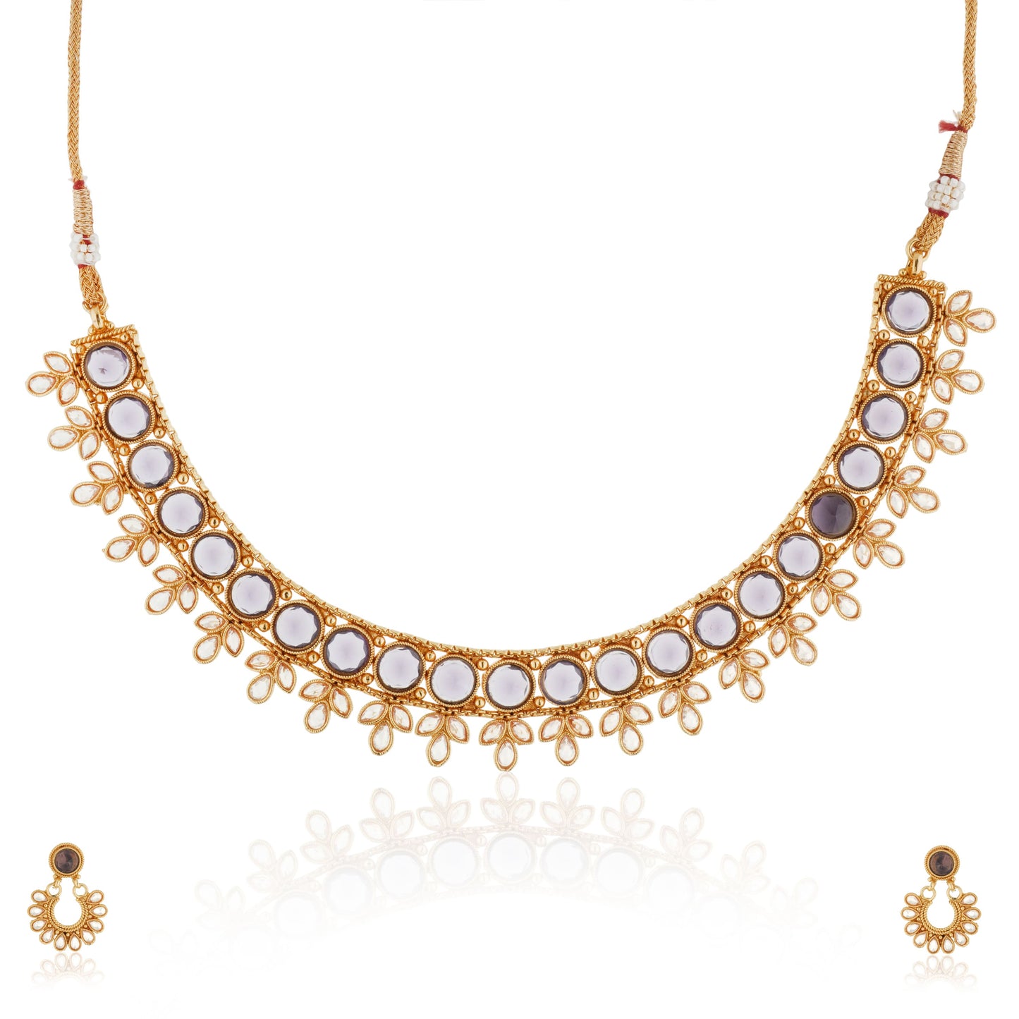 A PURPLE-COLORED KUNDAN-STUDDED NECKLACE SET FEATURES RICH PURPLE STONES PAIRED WITH INTRICATE KUNDAN WORK.