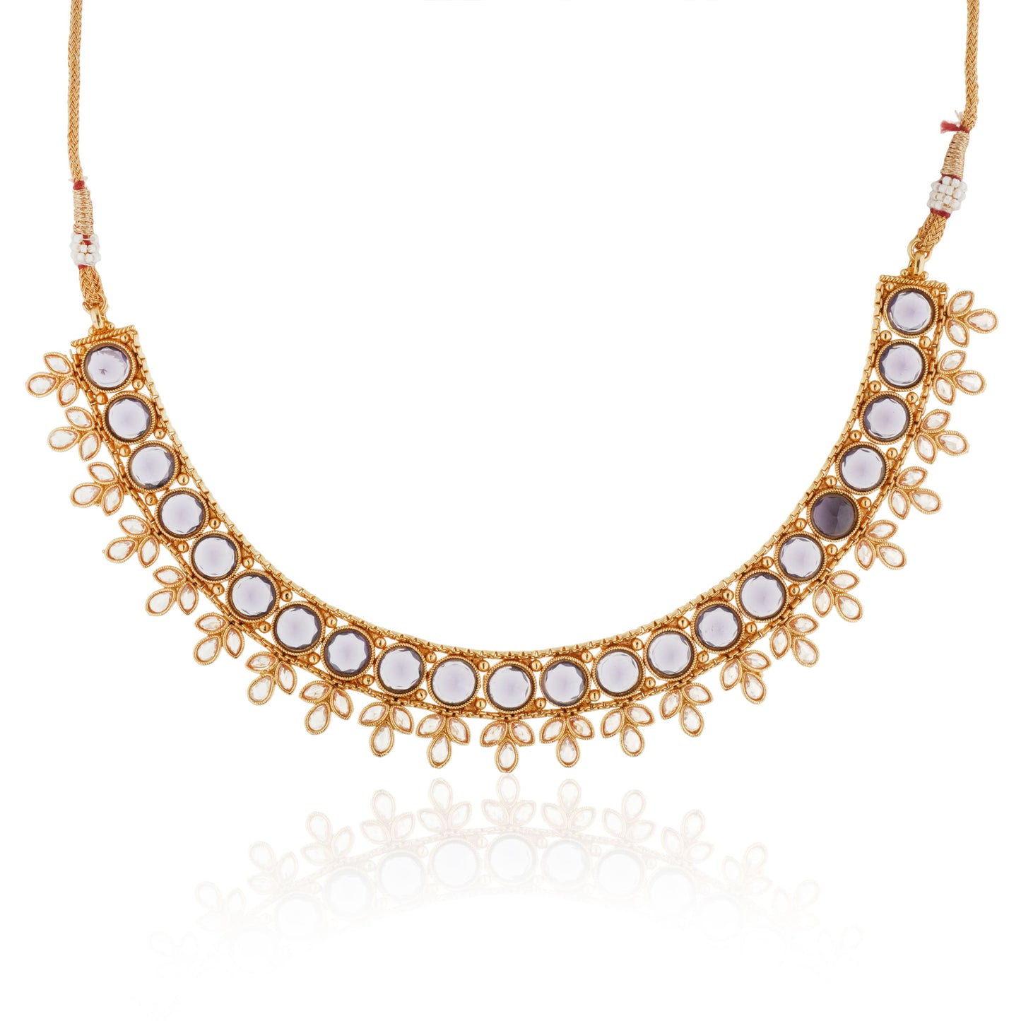 A PURPLE-COLORED KUNDAN-STUDDED NECKLACE SET FEATURES RICH PURPLE STONES PAIRED WITH INTRICATE KUNDAN WORK.