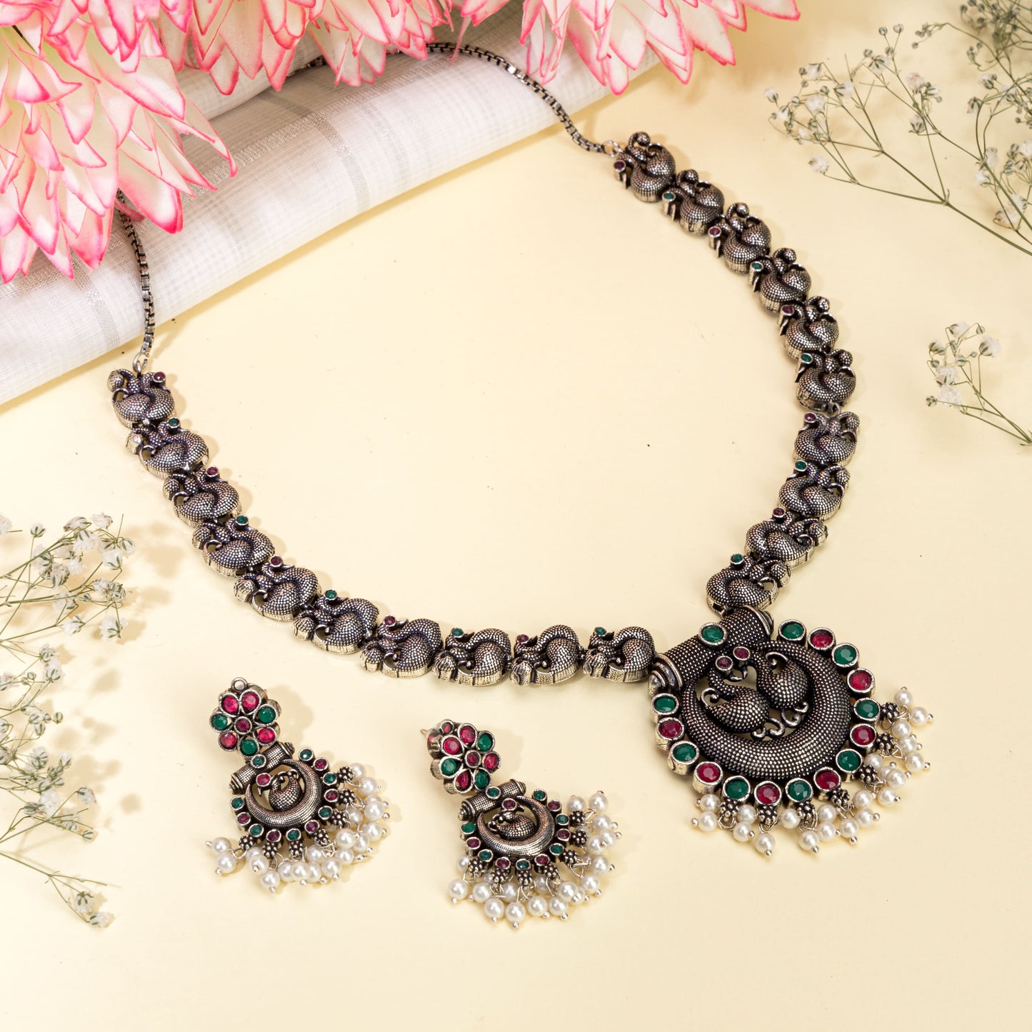 BEAUTIFULLY CRAFTED OXIDIZED NECKLACE SET FEATURING AN INTRICATE PEACOCK DESIGN.