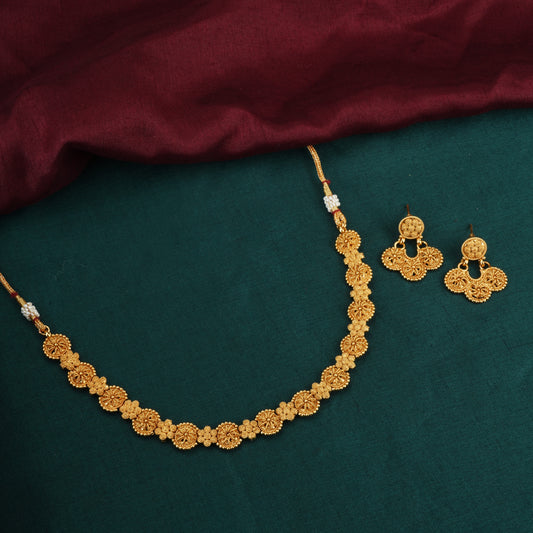 A GOLDTONE NECKLACE SET FEATURES A NECKLACE AND MATCHING EARRINGS WITH A GOLDEN FINISH,