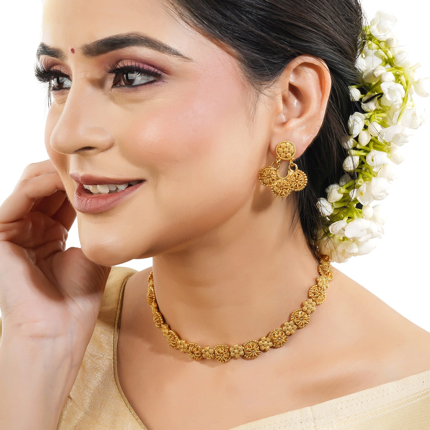 A GOLDTONE NECKLACE SET FEATURES A NECKLACE AND MATCHING EARRINGS WITH A GOLDEN FINISH,