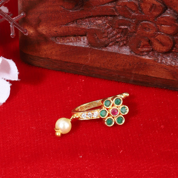 Kundan-studded goldtone nosepin with intricate detailing and a classic goldtone finish.
