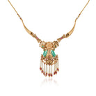 Graceful gold-tone long necklace adorned with pearls, blending tradition with sophistication.
