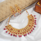 Elegant gold-tone choker necklace set with matching earrings, perfect for festive occasions
