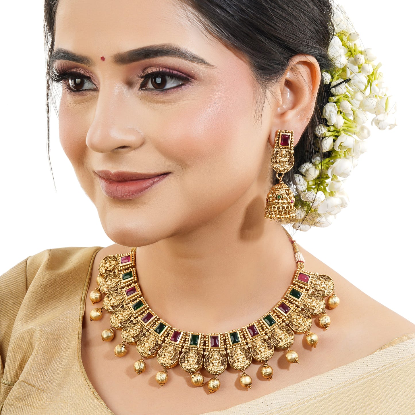 THIS EXQUISITE SET FEATURES A BEAUTIFULLY DETAILED CHOKER AND MATCHING EARRINGS, ALL INTRICATELY DESIGNED WITH TRADITIONAL MOTIFS OF LAXMI MAA.