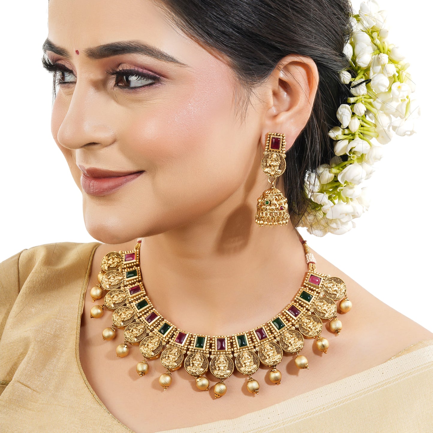 THIS EXQUISITE SET FEATURES A BEAUTIFULLY DETAILED CHOKER AND MATCHING EARRINGS, ALL INTRICATELY DESIGNED WITH TRADITIONAL MOTIFS OF LAXMI MAA.