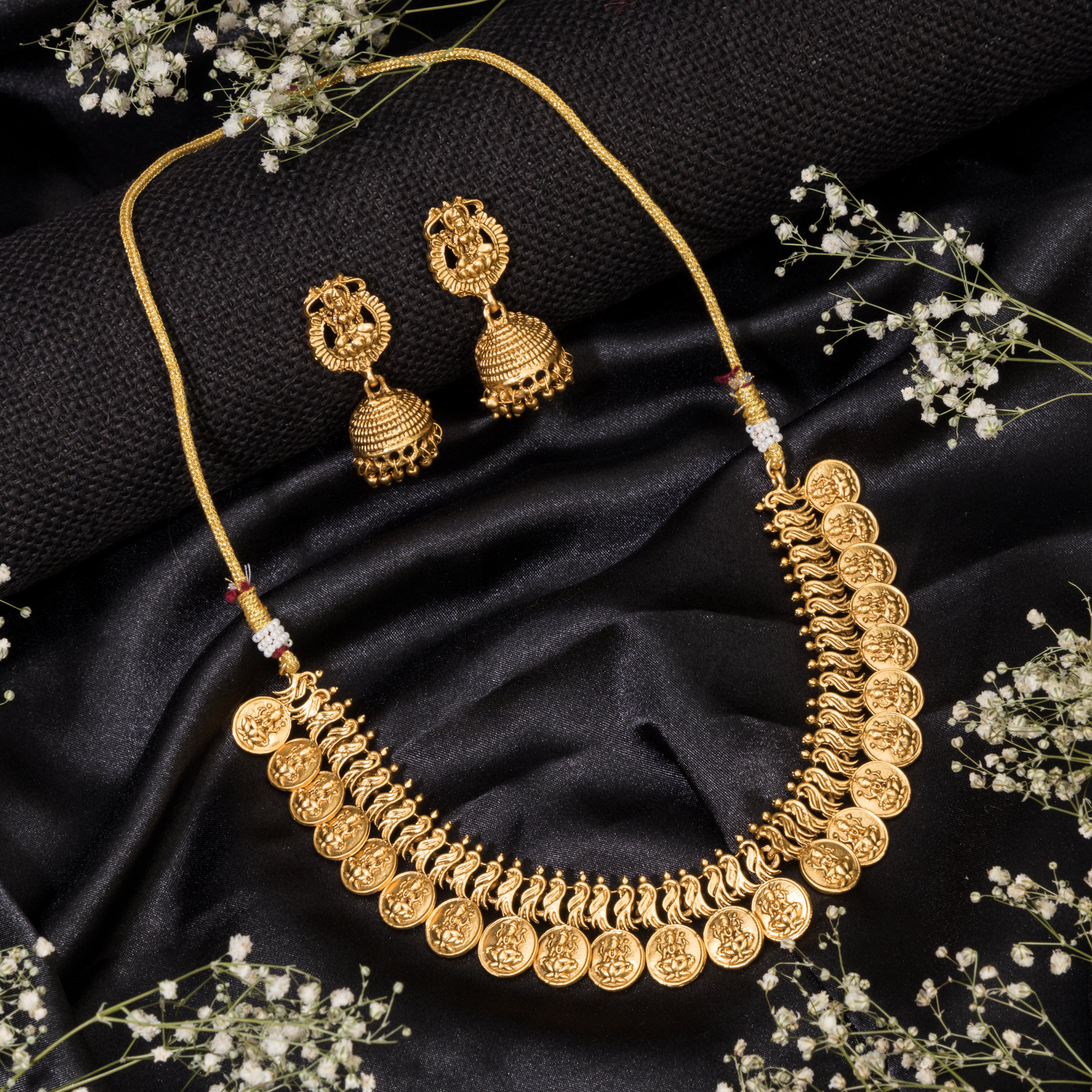 Goddess Laxmi long necklace set with temple design and matching earrings for festive elegance.
