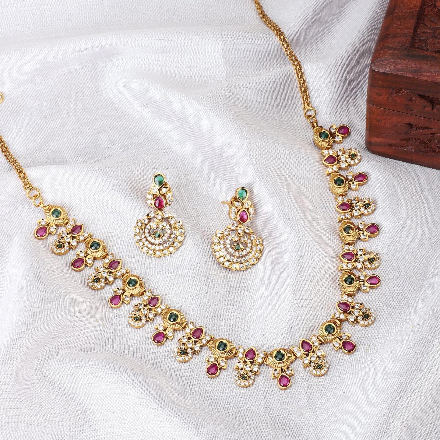 MULTICOLOR STONES-STUDDED GOLDTONE NECKLACE SET AND MATCHING EARRINGS ADORNED WITH VIBRANT STONES SET IN A GOLDTONE FINISH.