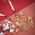 Elegant gold-tone long necklace set with multicolored stones and pearls, perfect for festive occasions.
