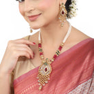 Elegant gold-tone long necklace set with multicolored stones and pearls, perfect for festive occasions.
