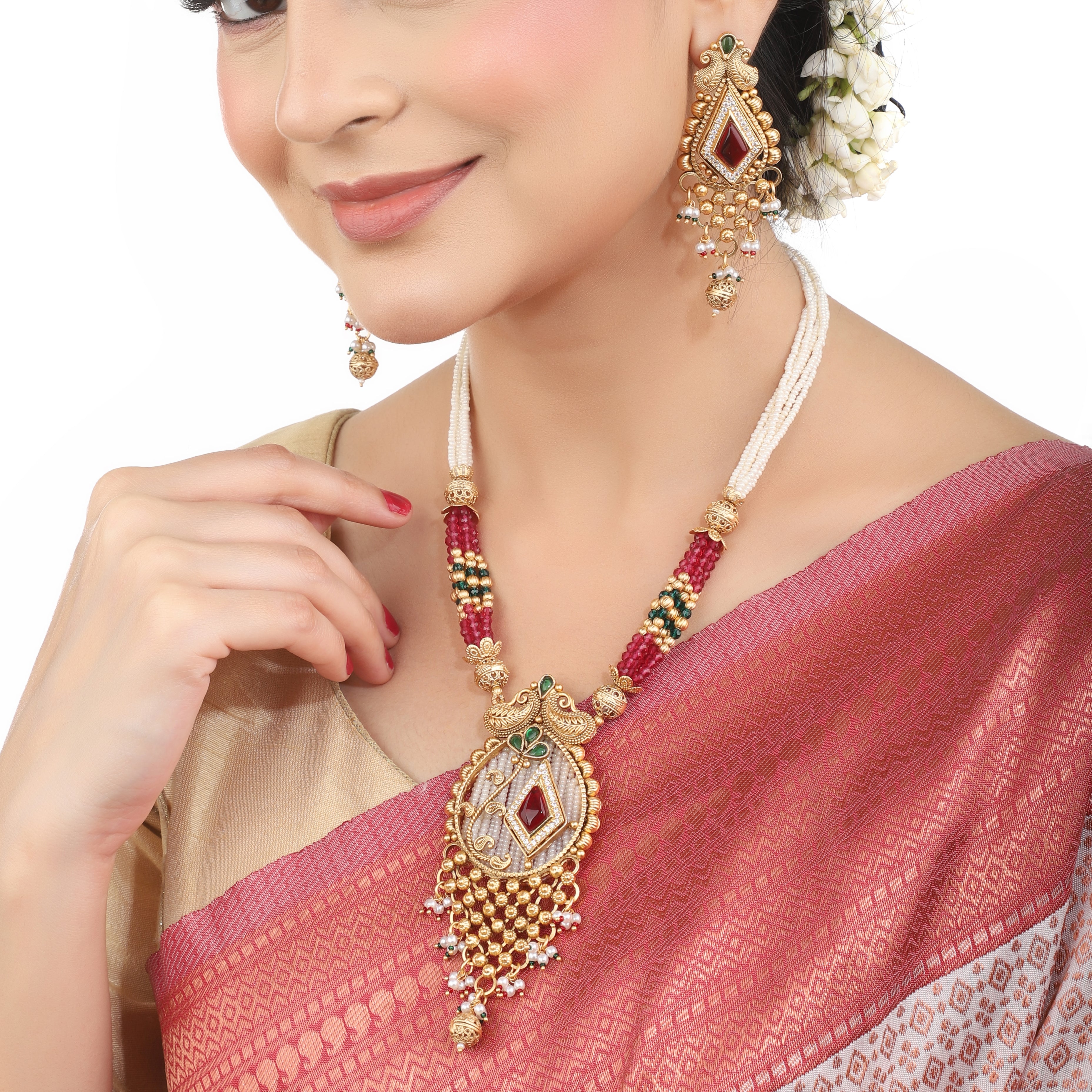 Elegant gold-tone long necklace set with multicolored stones and pearls, perfect for festive occasions.
