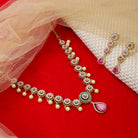 "Elegant gold-tone short necklace set with pink and white zircon stones for a sophisticated touch."
