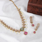 "Elegant gold-tone short necklace set with pink and white zircon stones for a sophisticated touch."
