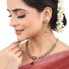 "Elegant gold-tone short necklace set with pink and white zircon stones for a sophisticated touch."
