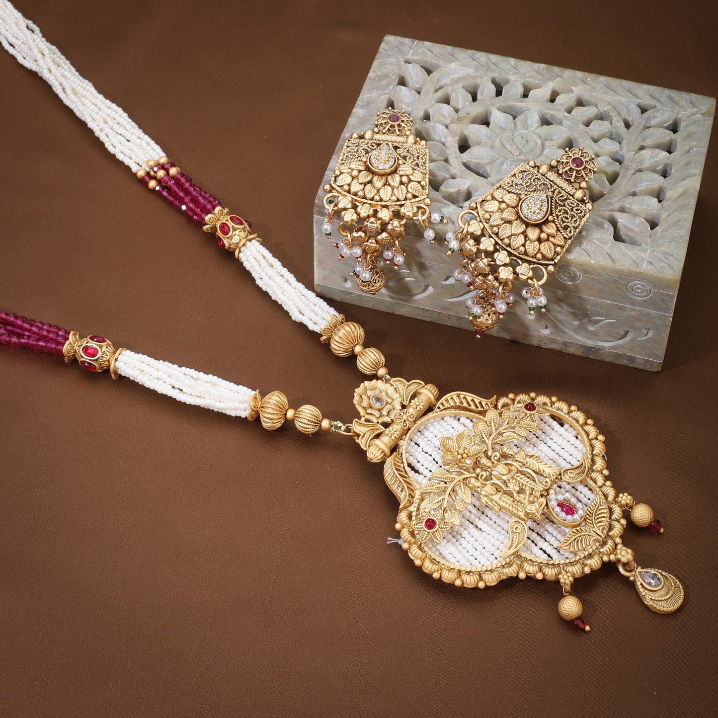 "RAM, LAXMAN, AND SITA CRAFTED GOLDEN LONG NECKLACE SET  COMPLEMENTED BY SMALL WHITE AND PINK PEARLS.  "