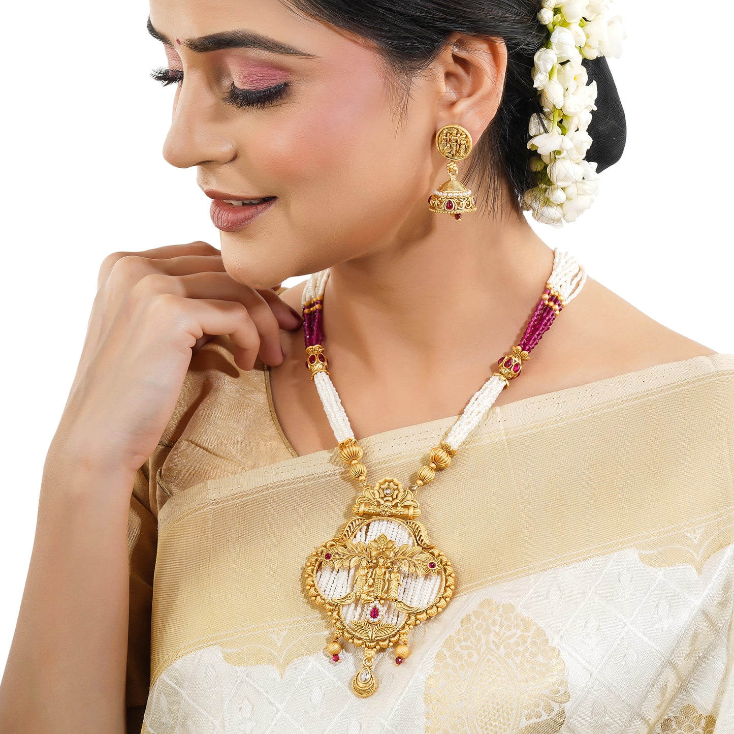 "RAM, LAXMAN, AND SITA CRAFTED GOLDEN LONG NECKLACE SET  COMPLEMENTED BY SMALL WHITE AND PINK PEARLS.  "