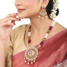 Elegant gold-tone long necklace set with Meekari design and small pearls, perfect for festive occasions.
