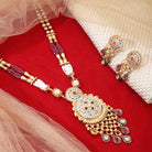 "Beautifully crafted long gold-tone necklace set with intricate Meenakari design, perfect for festivals."
