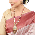 "Beautifully crafted long gold-tone necklace set with intricate Meenakari design, perfect for festivals."
