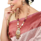 "Beautifully crafted long gold-tone necklace set with intricate Meenakari design, perfect for festivals."
