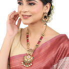 Stunning long gold-tone necklace set studded with multicolored stones, adding bold vibrance."
