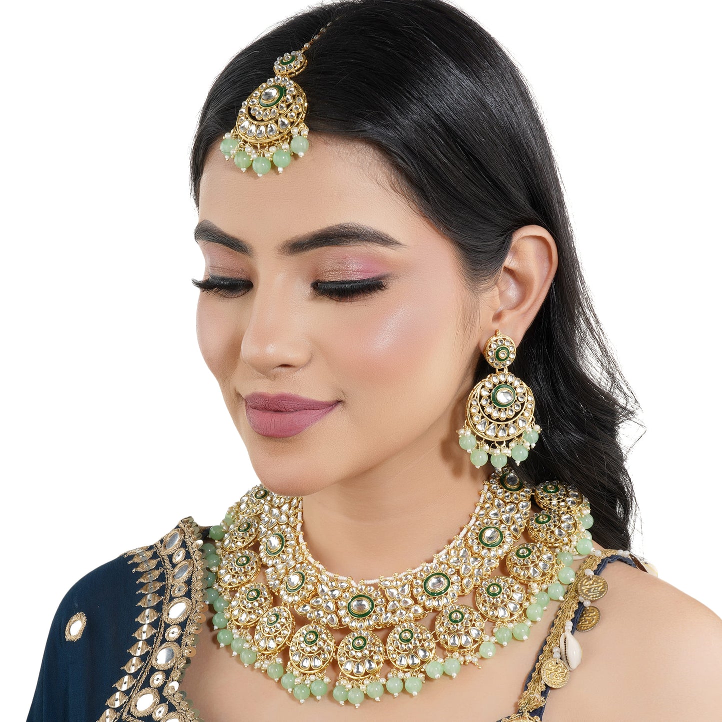 CA02CO04874GREEN-COLORED PEARLS-STUDDED BRIDAL SET INCLUDES A KUNDAN NECKLACE, MAANG TIKA, AND MATCHING EARRINGS.  THIS SET ADDS A REGAL AND ELEGANT TOUCH TO BRIDAL ATTIRE.