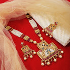 "Elegant gold-tone long necklace set with white pearls, adding a refined and classic festive touch."
