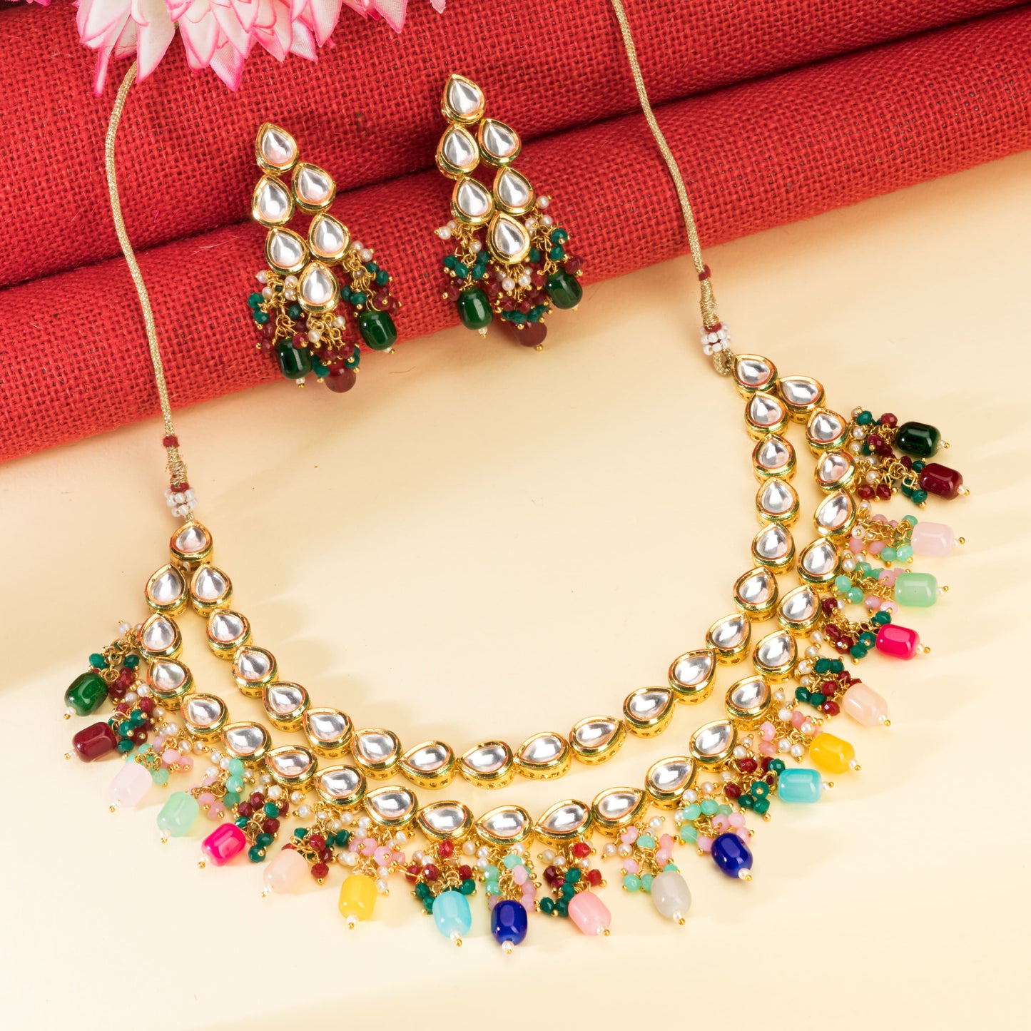 ELEGANT DOUBLE-LAYER KUNDAN NECKLACE SET STUDDED WITH MULTICOLORED PEARLS, OFFERING A VIBRANT AND SOPHISTICATED LOOK."