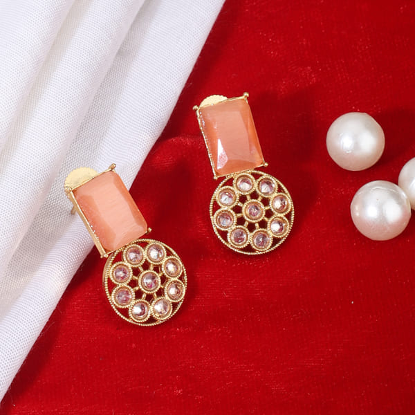 SALMON-COLORED STONES-STUDDED KUNDAN STUDS FEATURE  INTRICATE KUNDAN WORK.