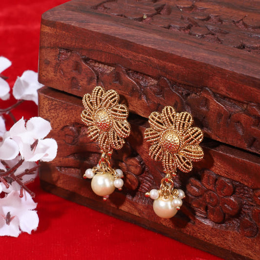 FLORAL DESIGN GOLDTONE EARRINGS FEATURE A GOLDEN FINISH WITH INTRICATE FLORAL PATTERNS.