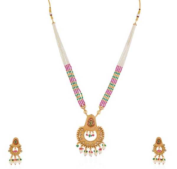 "Classic goldtone long necklace set with matching earrings for a festive, elegant look."
