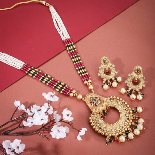 CLASSIC GOLD-TONE LONG NECKLACE SET PAIRED WITH MATCHING GOLD-TONE EARRINGS,