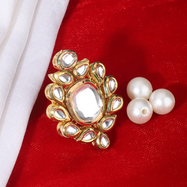 KUNDAN-STUDDED FINGER RING FEATURES INTRICATE KUNDAN STONES SET IN A DETAILED DESIGN.