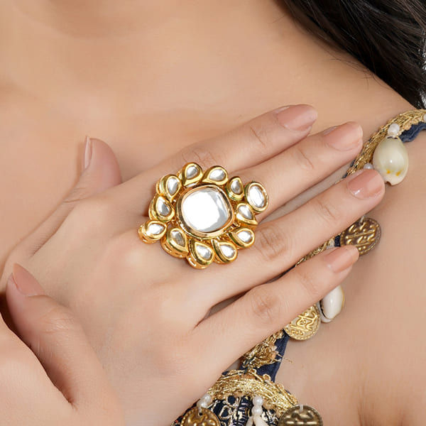 KUNDAN-STUDDED FINGER RING FEATURES INTRICATE KUNDAN STONES SET IN A DETAILED DESIGN.