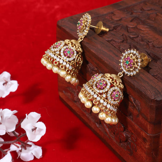 THESE GOLD-TONE JHUMKAS ARE BEAUTIFULLY ADORNED WITH MULTICOLORED STONES