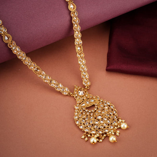 GOLDTONE LONG NECKLACE SET FEATURES A BEAUTIFULLY CRAFTED LONG NECKLACE ADORNED WITH INTRICATE KUNDAN