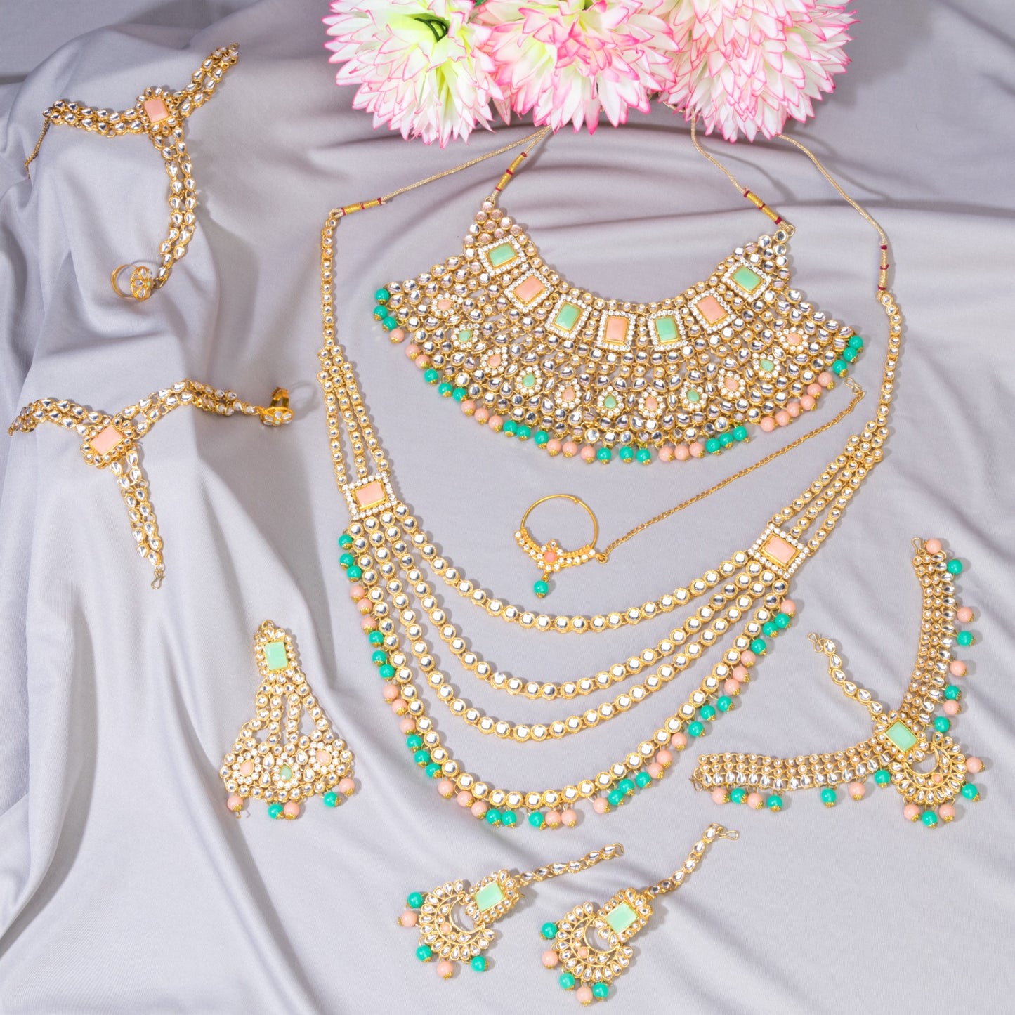 OOPULENT BRIDAL SET FEATURING KUNDAN AND MULTICOLORED PEARLS, INCLUDING EARRINGS, CHOKER, LONG NECKLACE, MAANG TIKKA, AND FINGER RING