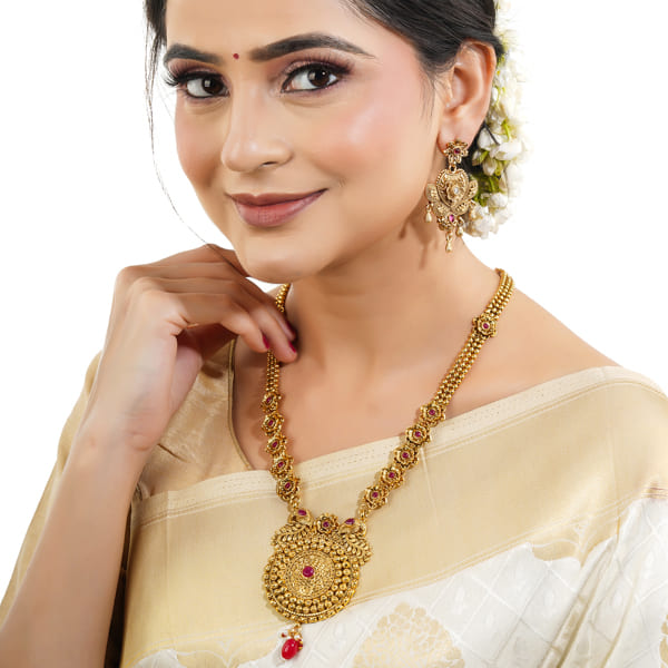 GOLD-TONE LONG NECKLACE SET WITH INTRICATE DETAILINGS WITH MATCHING EARRINGS