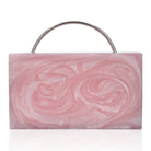 Elegant pink resin clutch with exquisite handle, perfect for elevating your party ensemble.
