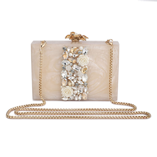 THIS HEAVILY EMBELLISHED CLUTCH, DESIGNED WITH AN EXTRA POCKET FOR ADDED CONVENIENCE AND A STURDY SLING THAT COMPLEMENTS ITS CHIC SLING KNOB.