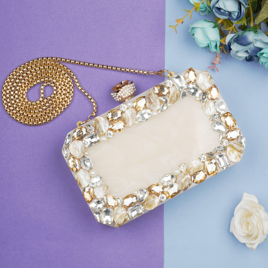 THIS RESIN-EMBELLISHED CLUTCH, FEATURING A DELICATE ROSE KNOB, A STURDY SLING, AND AN EXTRA POCKET FOR ADDED CONVENIENCE.